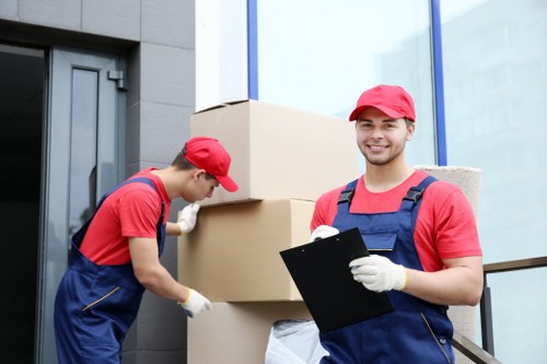 Removal team loading boxes and furniture for a local house move