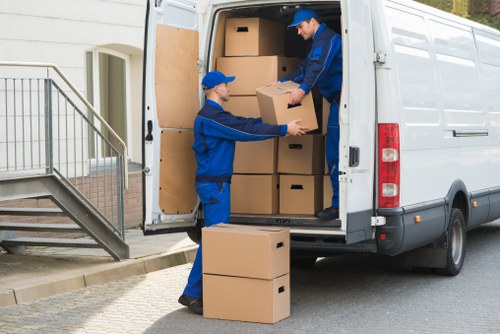 Team handling a removal job with careful lifting and loading