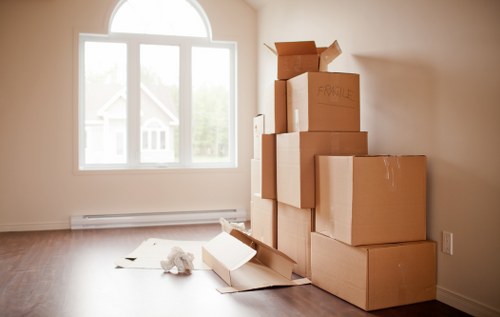 Professional movers loading items into a removal van