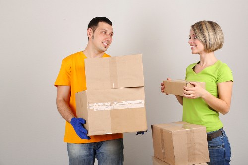 Moving boxes and labelled packages ready for unpacking in Norbury